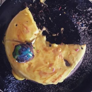 This is what remained of the space cake when I woke up the next morning. No one ate the Earth. Because my party guests are respectful. The green blob is Africa, duh.